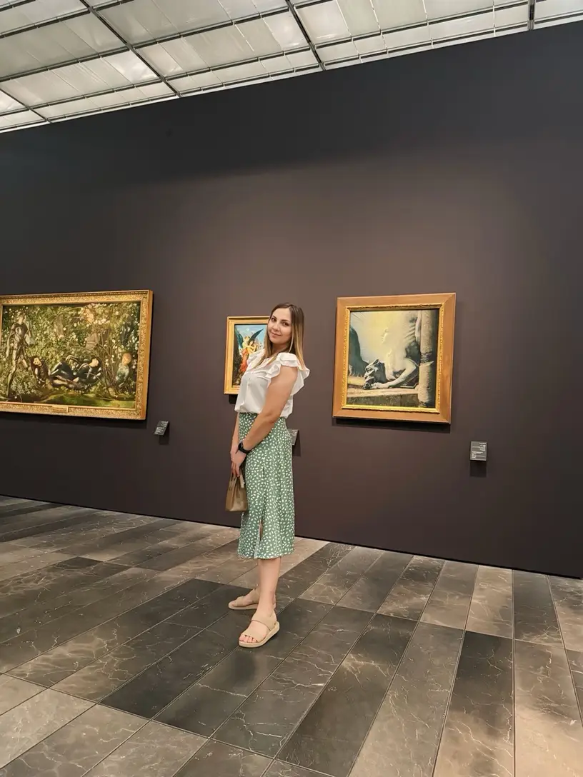 Happy customer posing in a museum