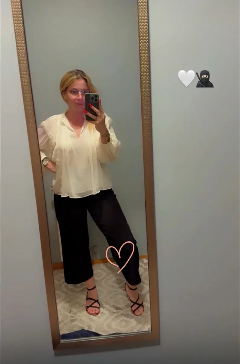 Content Customer posing in front of a mirror